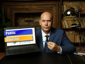 Conceptual photo about Public Adjuster with written phrase on the laptop.